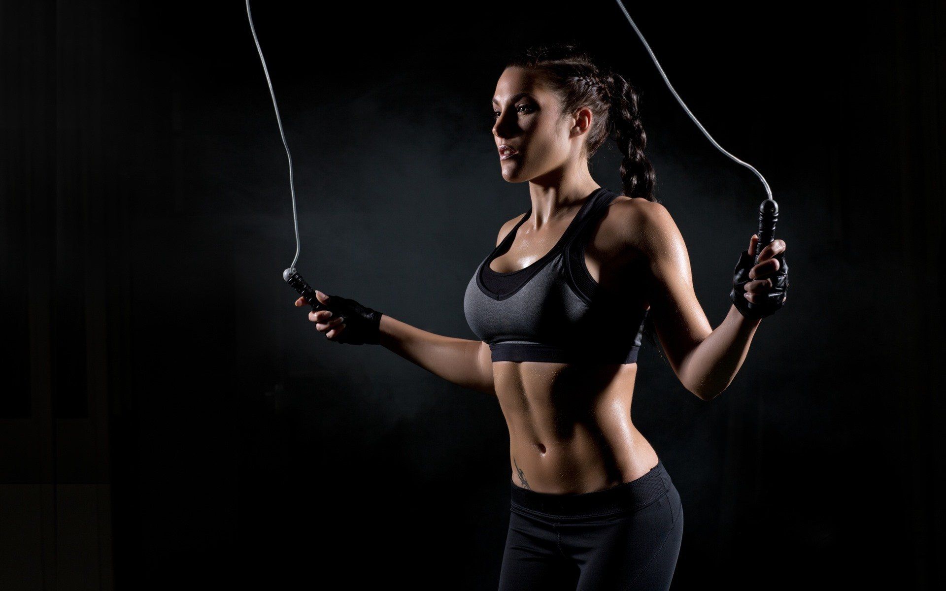 Fitness-girl-black-background-rope-skipping_1920x1200-2880w